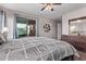 The main bedroom features a ceiling fan, sliding door to the patio, and a dark dresser at 7946 W Sonoma Way, Florence, AZ 85132