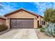 Charming home with a two-car garage, desert landscaping, and a well-maintained yard at 7946 W Sonoma Way, Florence, AZ 85132