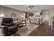 Open concept living area with hardwood floors, a ceiling fan, and a comfortable layout at 7946 W Sonoma Way, Florence, AZ 85132