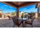 Inviting outdoor patio area for seating and dining with a beautiful sky view at 7946 W Sonoma Way, Florence, AZ 85132