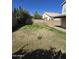 Large backyard with grass and potential for landscaping, creating an ideal space for outdoor gatherings at 849 W Spur Ave, Gilbert, AZ 85233