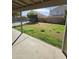 Backyard view of lawn area, patio, and swimming pool at 849 W Spur Ave, Gilbert, AZ 85233