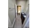 Bathroom featuring a double sink vanity with dark marble countertop and wood-look flooring at 849 W Spur Ave, Gilbert, AZ 85233