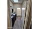 Bathroom featuring a double sink vanity with dark marble countertop and wood-look flooring at 849 W Spur Ave, Gilbert, AZ 85233