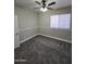 Carpeted bedroom with ceiling fan and window at 849 W Spur Ave, Gilbert, AZ 85233