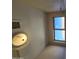 Bathroom featuring a ceiling fan, window with view to the sky, and air conditioning vent at 849 W Spur Ave, Gilbert, AZ 85233