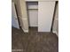 A closet with sliding doors, shelf and a wooden rod at 849 W Spur Ave, Gilbert, AZ 85233