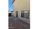 Side view of the house with a door leading to the yard and a window bringing natural light indoors at 849 W Spur Ave, Gilbert, AZ 85233