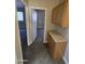 Hallway featuring a built-in cabinet storage with view into an adjacent bedroom at 849 W Spur Ave, Gilbert, AZ 85233