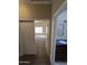 Hallway view showcasing a bedroom and bathroom, highlighting the home's layout at 849 W Spur Ave, Gilbert, AZ 85233