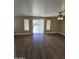 Bright living room featuring a sliding glass door, a ceiling fan, and wood-look floors at 849 W Spur Ave, Gilbert, AZ 85233