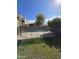 Backyard view of pool enclosed by black fence, complemented by lush landscaping at 849 W Spur Ave, Gilbert, AZ 85233