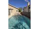 Backyard pool with clear water, surrounded by the home and block wall at 849 W Spur Ave, Gilbert, AZ 85233