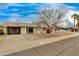 Charming single-story home featuring desert landscaping, covered parking and a welcoming entrance at 8608 E Vernon Ave, Scottsdale, AZ 85257