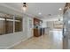 Bright kitchen features stainless steel appliances, dark cabinetry, and ample counter space at 8608 E Vernon Ave, Scottsdale, AZ 85257