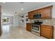 Well-equipped kitchen with stainless steel appliances and dark cabinets at 8608 E Vernon Ave, Scottsdale, AZ 85257