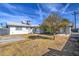 This backyard features a covered patio perfect for outdoor entertaining, along with mature trees and easy to maintain yard at 901 W Parkway Blvd, Tempe, AZ 85281