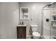 Bathroom with white shower, toilet, modern vanity and neutral color palette at 901 W Parkway Blvd, Tempe, AZ 85281