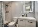 Bathroom featuring a sleek vanity with modern fixtures, mirror, and a step-in shower at 901 W Parkway Blvd, Tempe, AZ 85281