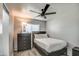 Cozy bedroom features a large window for natural light and a dark dresser for storage at 901 W Parkway Blvd, Tempe, AZ 85281