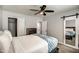 Comfortable bedroom with ceiling fan, closet, and barn-door mirror for a modern feel at 901 W Parkway Blvd, Tempe, AZ 85281