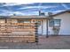 White single-story home with horizontal wood fence and brick walkway at 901 W Parkway Blvd, Tempe, AZ 85281