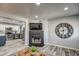 Spacious living area connected to kitchen with a decorative fireplace and vinyl floors at 901 W Parkway Blvd, Tempe, AZ 85281