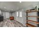 Entry space featuring wood look floors and a rustic shelving unit at 901 W Parkway Blvd, Tempe, AZ 85281