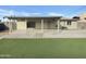 Cozy covered back patio and well-maintained yard, perfect for outdoor entertaining and relaxation at 9023 N 18Th Ave, Phoenix, AZ 85021