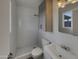 Modern bathroom featuring a tiled shower, sleek vanity, and updated fixtures at 9023 N 18Th Ave, Phoenix, AZ 85021