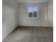 Neutral bedroom has carpet flooring and natural light from the window at 9023 N 18Th Ave, Phoenix, AZ 85021