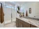 Bright bathroom featuring a glass shower, granite countertop, and modern vanity at 921 W Peralta Pass, Apache Junction, AZ 85120