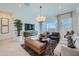 Open-concept living room with stylish furniture, large windows, and modern decor at 921 W Peralta Pass, Apache Junction, AZ 85120