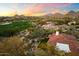 Elevated perspective of a luxurious property, showcasing manicured grounds, landscaping, and mountain views at 9290 E Thompson Peak Pkwy # 142, Scottsdale, AZ 85255