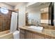 Bathroom with a modern square sink, a large mirror, and a tiled shower and bathtub at 9290 E Thompson Peak Pkwy # 142, Scottsdale, AZ 85255