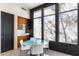 Breakfast nook with a glass table, modern lighting, and bright windows overlooking the exterior at 9290 E Thompson Peak Pkwy # 142, Scottsdale, AZ 85255