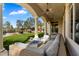 Spacious covered patio showcasing an outdoor seating area, ceiling fans, and manicured backyard at 9290 E Thompson Peak Pkwy # 142, Scottsdale, AZ 85255