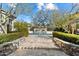 A serene pool area features stone accents, privacy hedges, and a tranquil water feature at 9290 E Thompson Peak Pkwy # 142, Scottsdale, AZ 85255