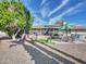 Expansive backyard featuring gravel landscaping, patio with seating, and a soothing hot tub, perfect for outdoor relaxation at 9313 W Arrowhead Dr, Sun City, AZ 85351