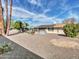 Private backyard with minimal plantings featuring gravel landscaping, perfect for low-maintenance enjoyment at 9313 W Arrowhead Dr, Sun City, AZ 85351