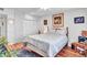 Bedroom featuring a cozy bed, white built-ins, and wood flooring at 9313 W Arrowhead Dr, Sun City, AZ 85351