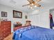 Bedroom featuring a ceiling fan, wood flooring and wardrobe at 9313 W Arrowhead Dr, Sun City, AZ 85351