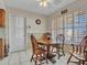 Comfortable dining area featuring a wood table, chairs, and bright window at 9313 W Arrowhead Dr, Sun City, AZ 85351