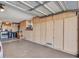 Garage with built-in cabinetry offers ample storage and organization space for tools, equipment, and household items at 9313 W Arrowhead Dr, Sun City, AZ 85351