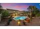 Expansive backyard with desert landscaping, a sparkling pool, and a covered patio offering stunning views at 10829 N 11Th Pl, Phoenix, AZ 85020
