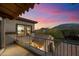 Balcony offering panoramic views of the neighborhood, mountain views, lush landscaping, and a colorful sunset sky at 10829 N 11Th Pl, Phoenix, AZ 85020
