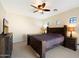 Spacious bedroom featuring a ceiling fan, television, and decorative windows providing natural light at 10829 N 11Th Pl, Phoenix, AZ 85020