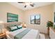 Cozy bedroom with a queen-size bed, stylish decor, and a window offering a pleasant neighborhood view at 10829 N 11Th Pl, Phoenix, AZ 85020