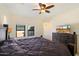 Bedroom with a large bed, ceiling fan, and TV sitting atop a dresser at 10829 N 11Th Pl, Phoenix, AZ 85020