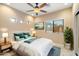 Bright bedroom with a queen-size bed, stylish decor, and multiple windows offering natural light at 10829 N 11Th Pl, Phoenix, AZ 85020